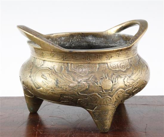 A Chinese bronze tripod censer, Xuande two character mark, 19th century, diam. 18cm, weight 2780g., old repair to base